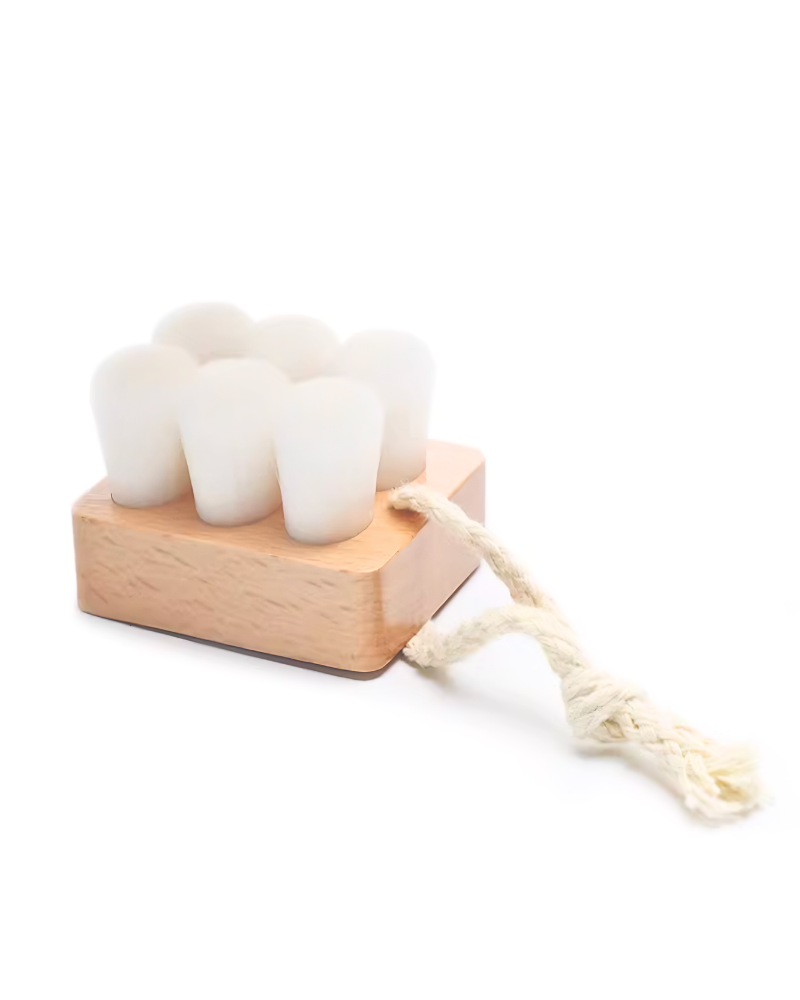 The IREN Shizen Facial Cleansing Brush features ultra-soft bristles and a rope handle for gentle cleansing, shown against a white background.