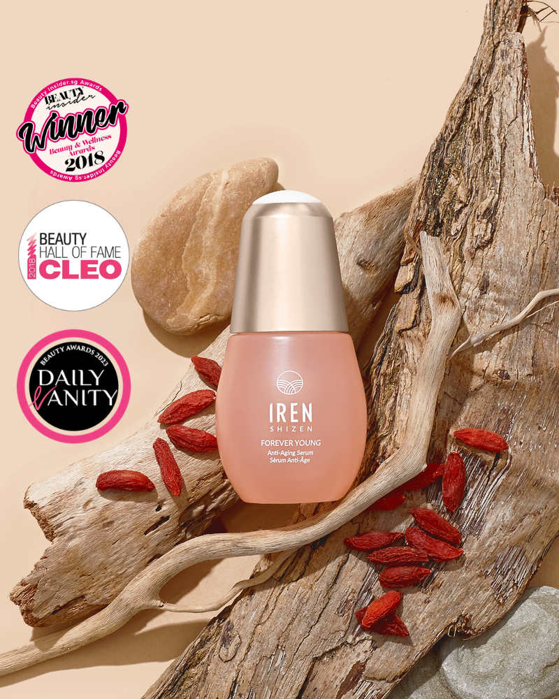FOREVER YOUNG Anti-Aging Serum by IREN Shizen, shown on driftwood with goji berries and award badges for Best Winner 2018, Beauty Hall of Fame Cleo, and Daily Vanity—promotes anti-aging and supports collagen production.