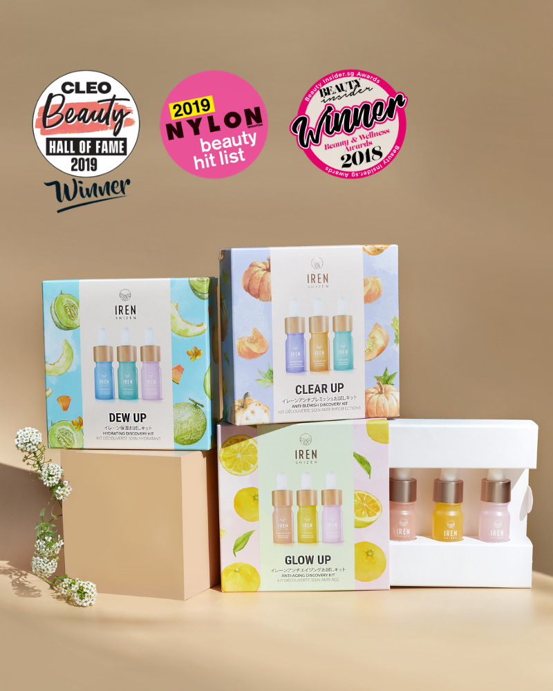 Three IREN Shizen DEW UP Hydrating Discovery Kits and a box of hydrating serum minis are displayed with floral decor, while award badges appear above the products.