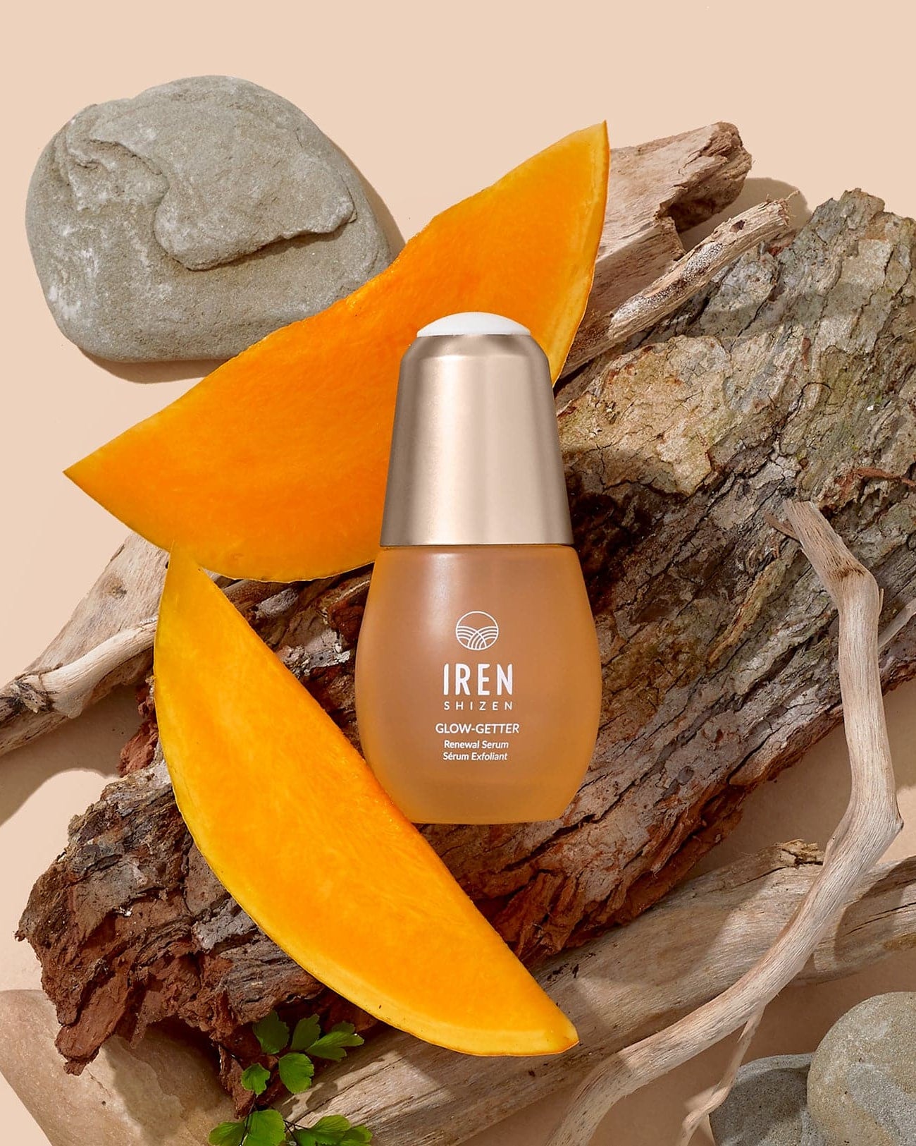 A bottle of customised Japanese skincare Glow-Getter Renewal Serum by IREN Shizen next to a slice of orange. #all-groups