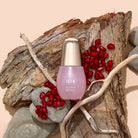 A bottle of customised Japanese SKIN REBOOT Antioxidant Serum by IREN Shizen on top of a piece of wood. #all-groups