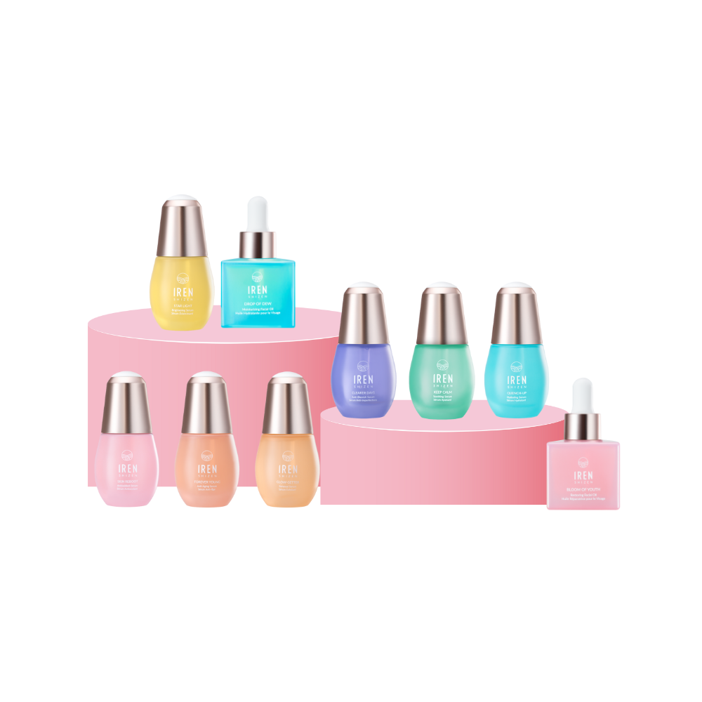 A display of ten skincare bottles on pink circular platforms, featuring various colors and dropper caps.