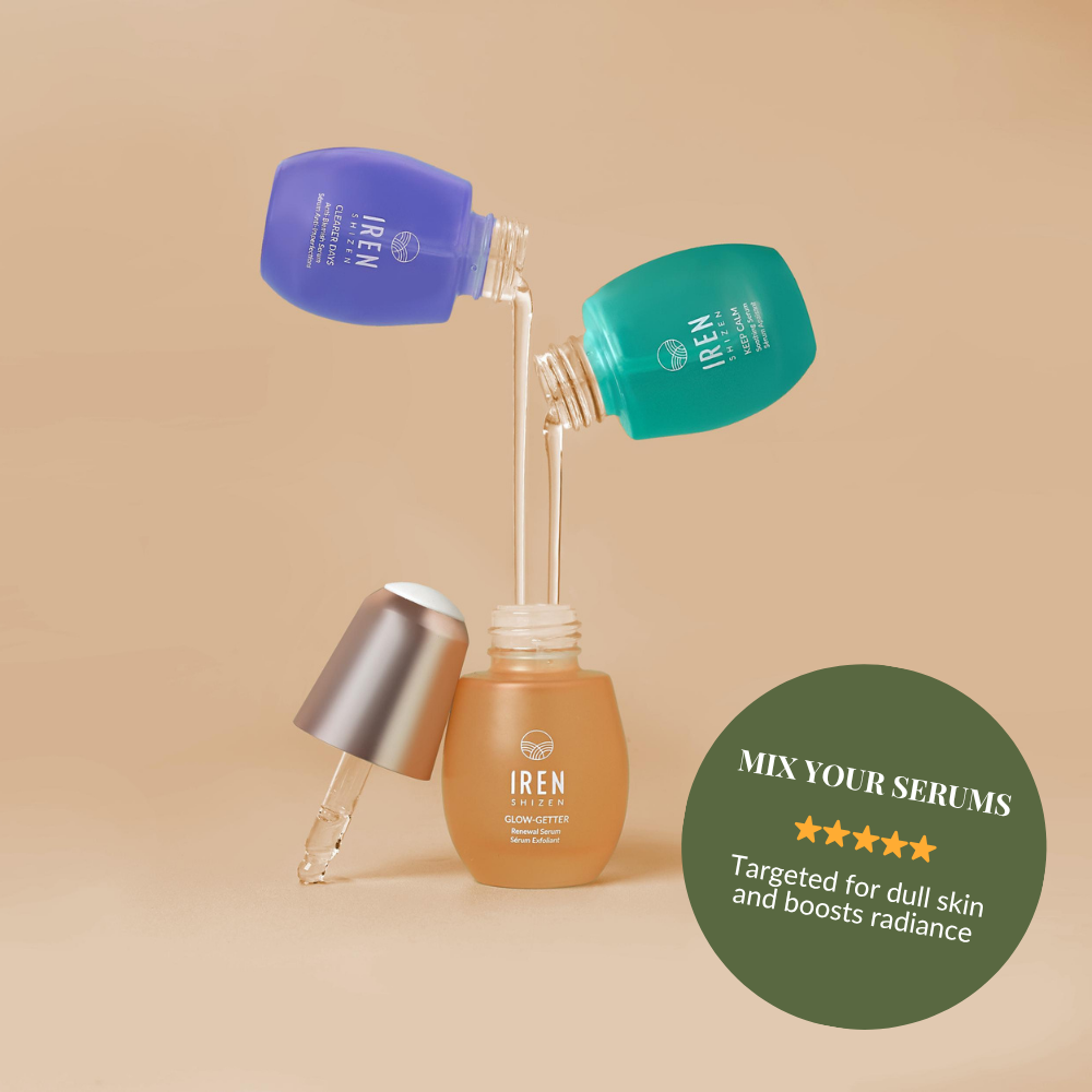 Three colored serum bottles, blue and green, pour liquid into an orange bottle. Text: “Mix your serums. IREN Shizen CLEAR UP Anti-Blemish Discovery Kit targets dull skin, boosts radiance, and promotes a clear complexion.”.