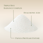 A fine white powder labeled with Triple Rice Radiance Complex, Hyaluronic Acid, and Papaya Protease Enzyme suggests Fast Bundle's Cloud Cleansing Kit—an enzyme powder wash for gentle, radiant cleansing.