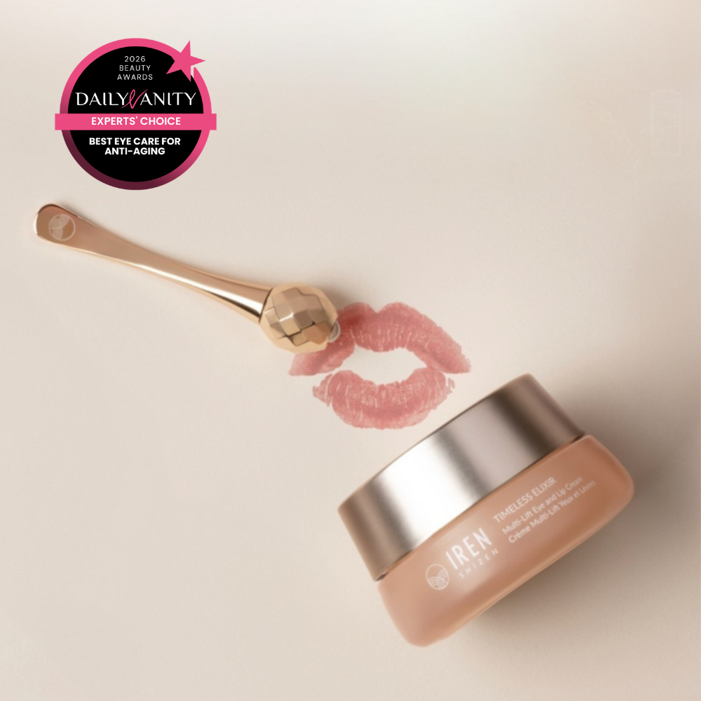 A jar of IREN Shizen TIMELESS ELIXIR Multi-Lift Eye and Lip Cream, a gold facial roller, and a lipstick mark on a light surface with a "Best Eye Care for Anti-Aging" award—perfect for reducing dark circles.