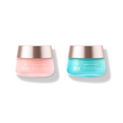 The Day & Night Moisturiser Set from IREN Shizen features two luxurious jars: a pink "Flowers in Bloom" and a blue "Freeze the Youth," both with white caps, providing optimal hydration and youth-preserving benefits.