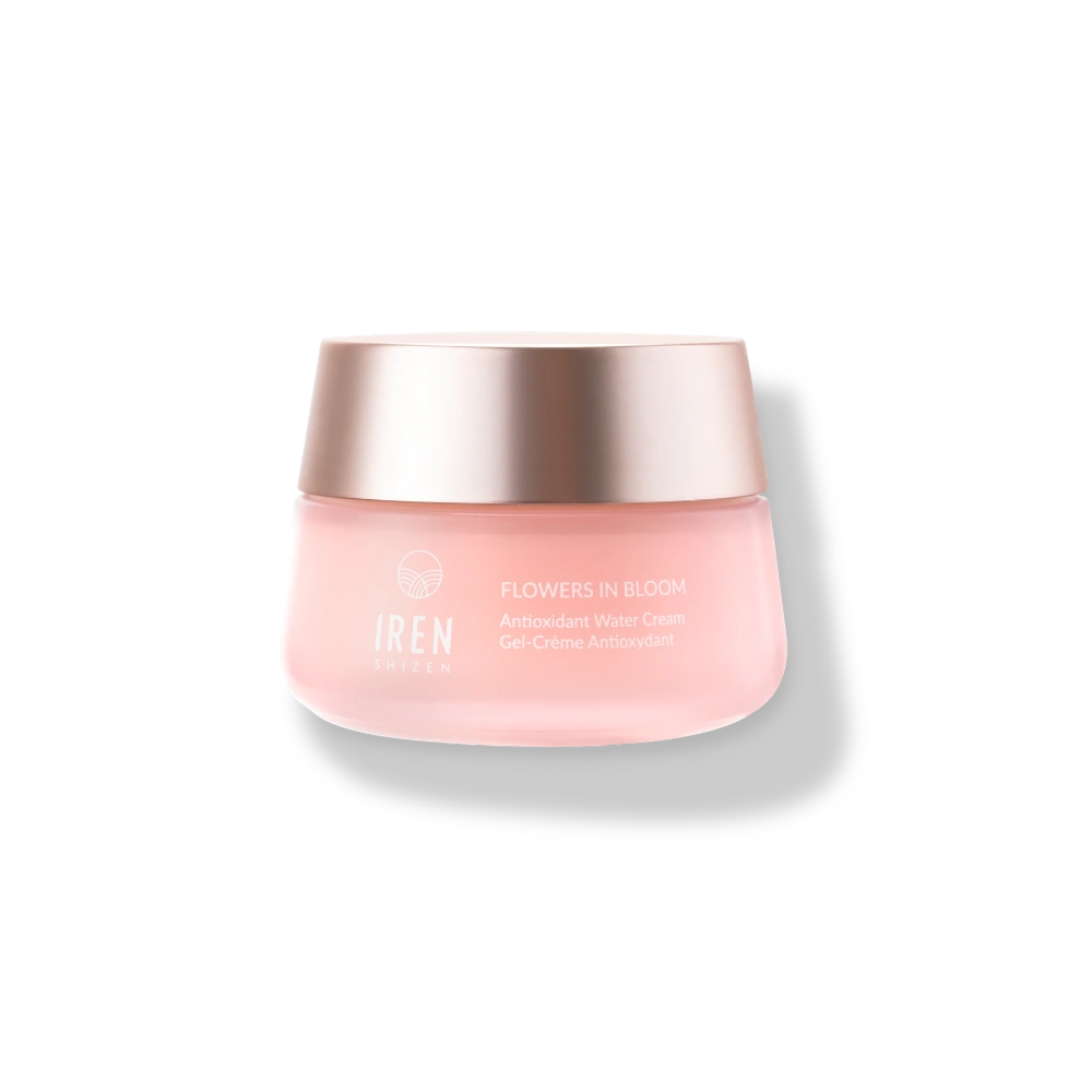 A pink jar of IREN Shizen FLOWERS IN BLOOM Antioxidant Water Cream, a hydrating gel cream with a gold lid, sits on a light background—your new go-to for natural skincare.