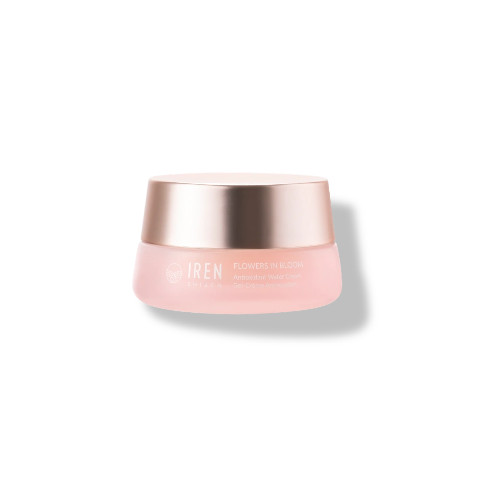 A pink jar with a metallic gold lid labeled "IREN Shizen FLOWERS IN BLOOM Antioxidant Water Cream," this natural, non-comedogenic hydrator is shown on a plain white background.