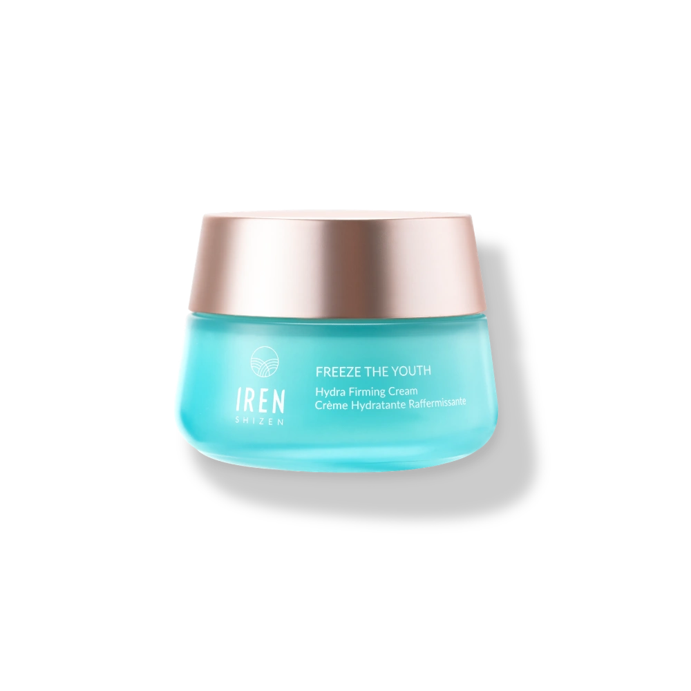A blue jar of IREN Shizen FREEZE THE YOUTH Hydra Firming Cream with a rose gold metallic lid is shown on a plain white background.