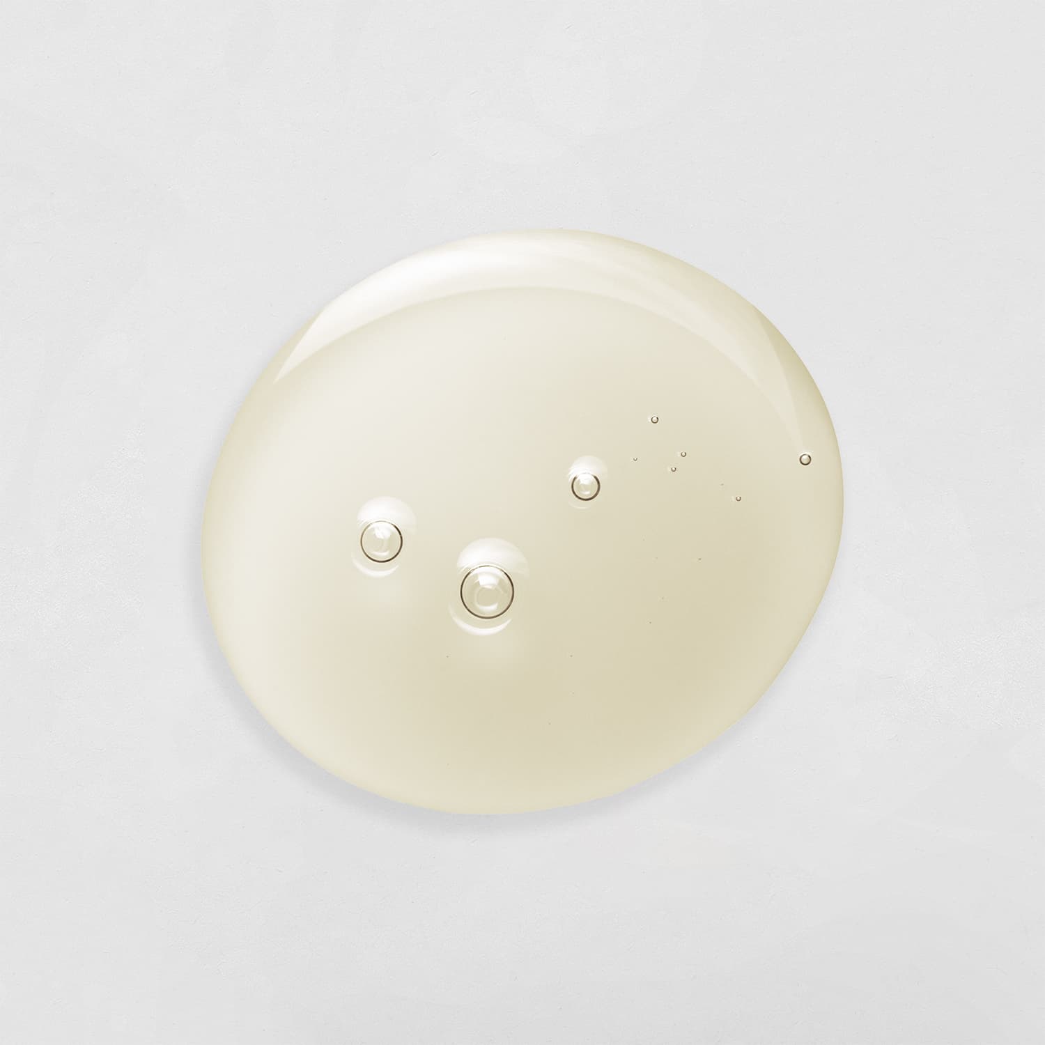 A white DROP OF DEW Moisturizing Facial Oil circle on a white background from the brand IREN Shizen, known for its customised Japanese skincare products. all-groups