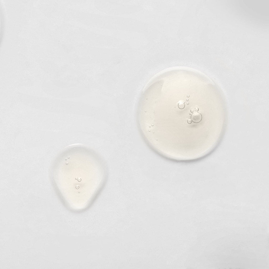 A group of custom skincare IREN Shizen KEEP CALM Soothing Serum circles on a white surface.